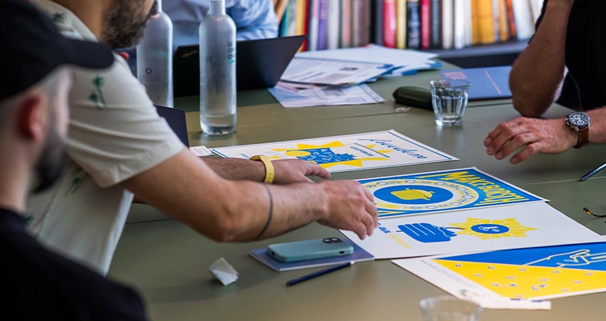 Jury reviewing Ukraine poster project