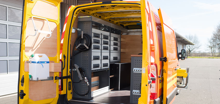 A service van with its rear doors open. 